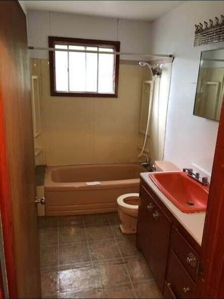 Bathroom before — retro fixtures and worn finishes