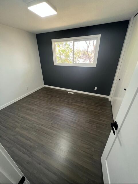 Bedroom with feature wall and new flooring