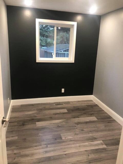Bedroom with dark feature wall