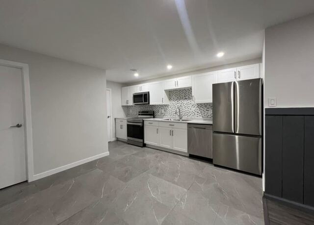 Basement suite kitchen with modern finishes