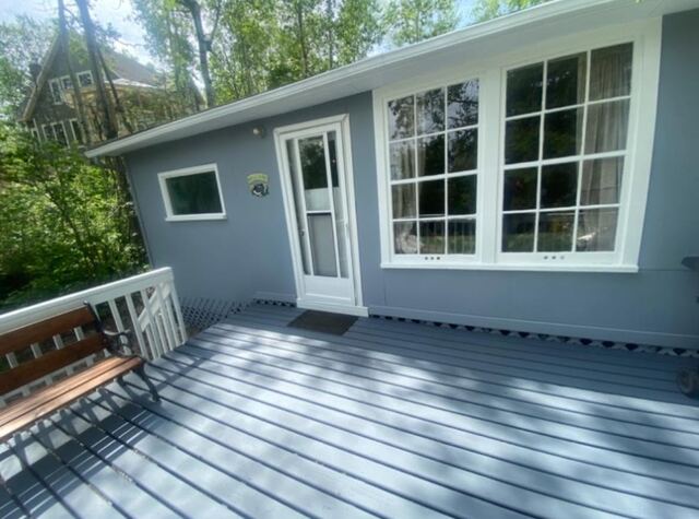 Renovated lake cabin with new deck and paint