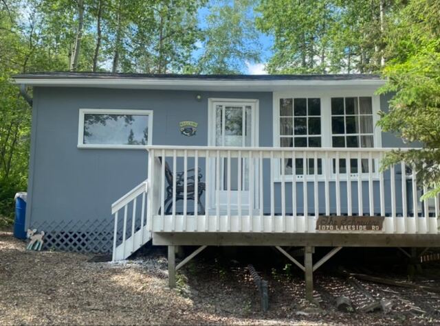 Cabin with white deck railing