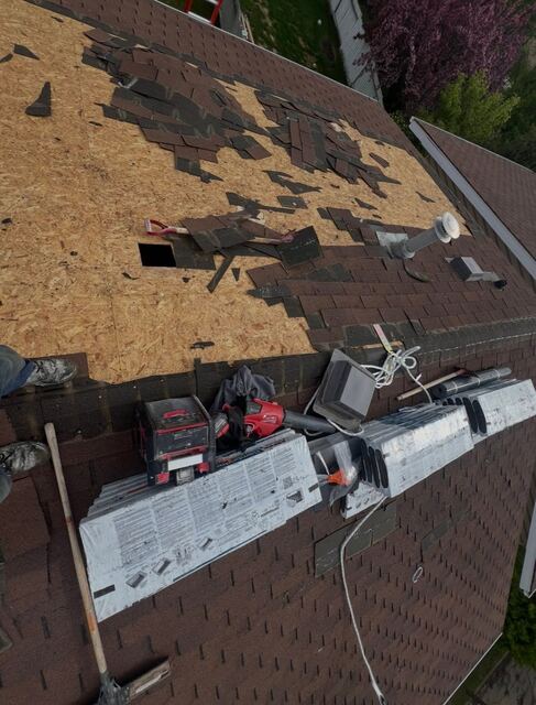 Roof tear-off in progress